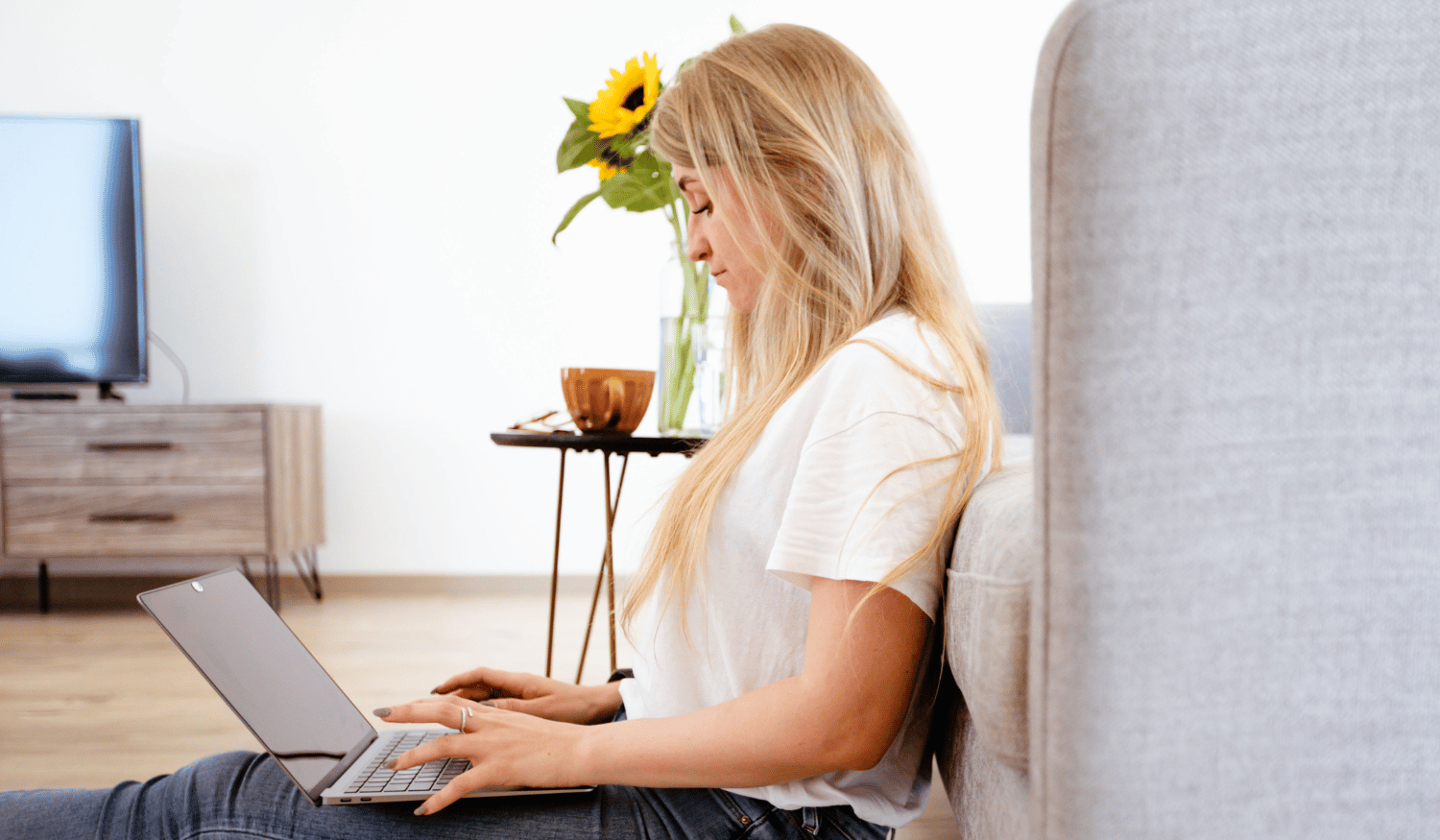 A customer on their laptop typing an email