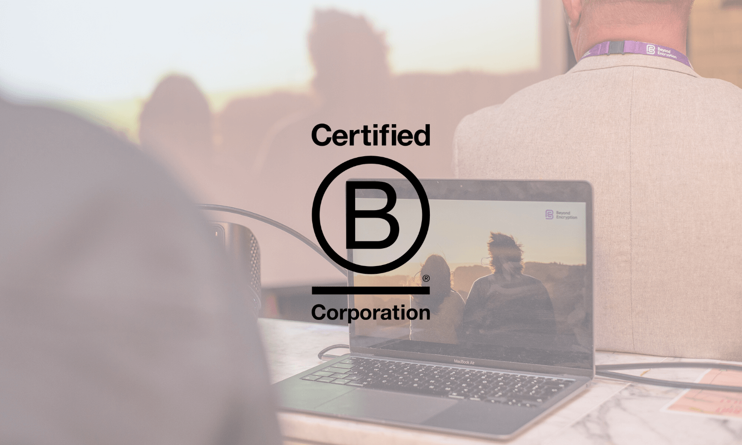 Certified B Corp logo with Beyond Encryption video in background