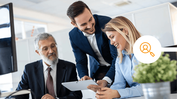 Colleagues reviewing security analytics in office together