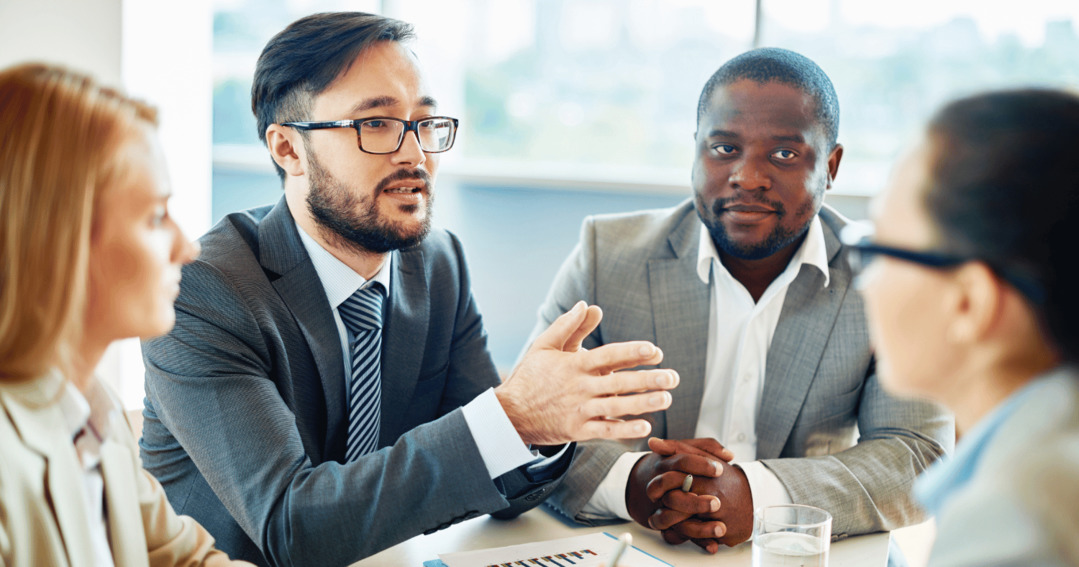 Compliance office describing email security risks to colleagues
