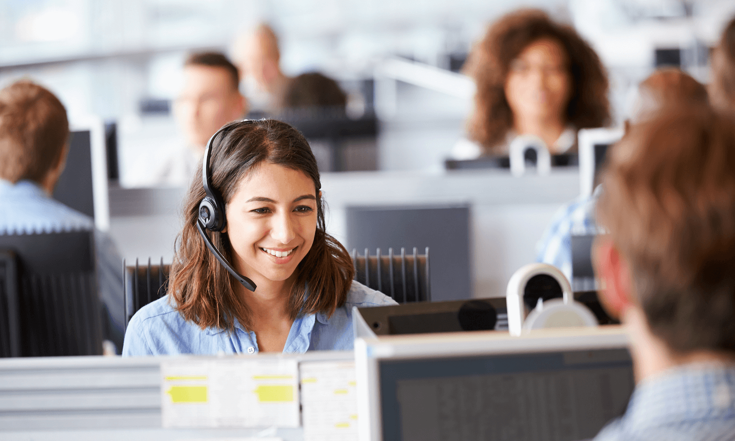 Customer service operator speaking to customer securely