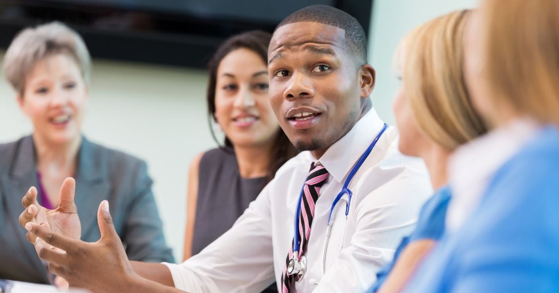 Doctor in meeting with healthcare board