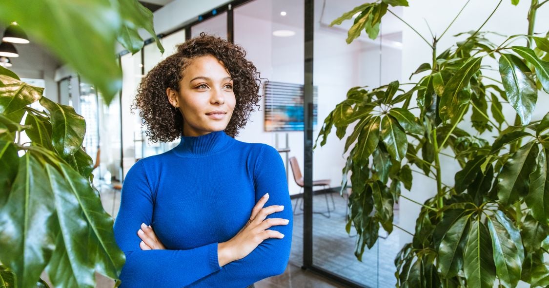 Female leader smiling in sustainable office