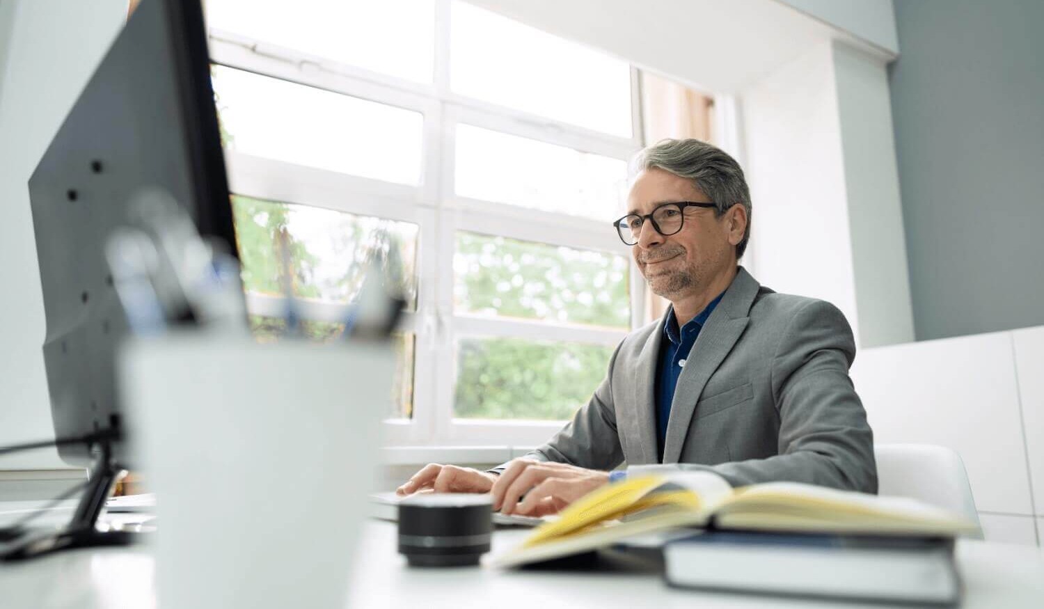 Financial adviser sending a secure email using a desktop computer