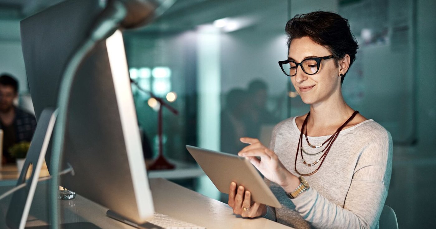 IT compliance officer reviewing email security in office