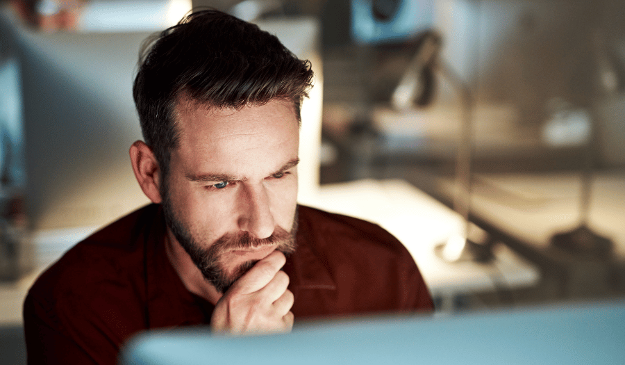 IT manager reviewing information security in office