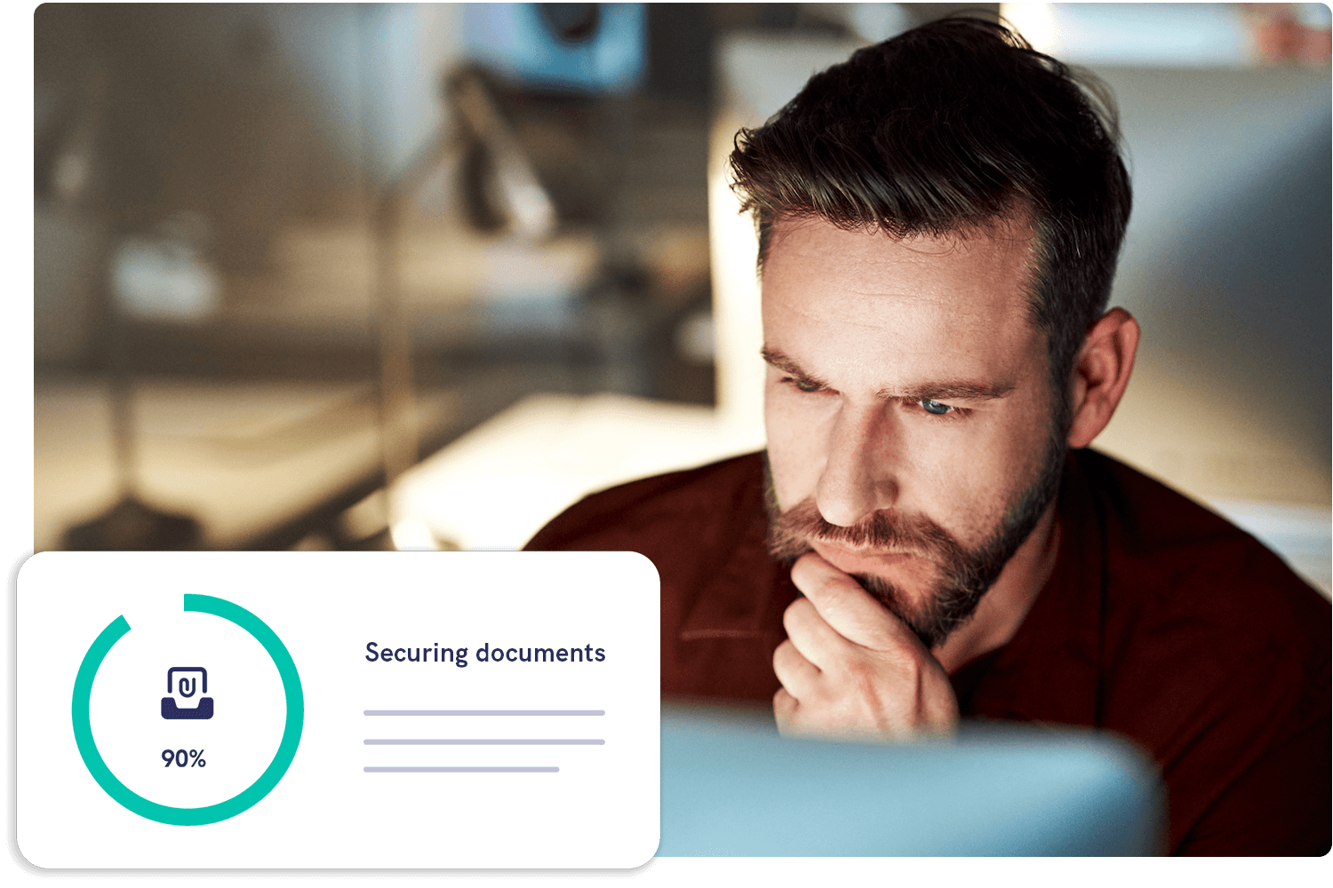 IT team member looking at computer with email encryption