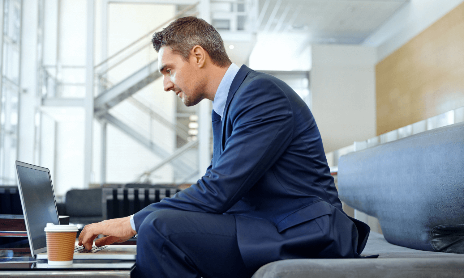 Male professional using laptop to secure emails