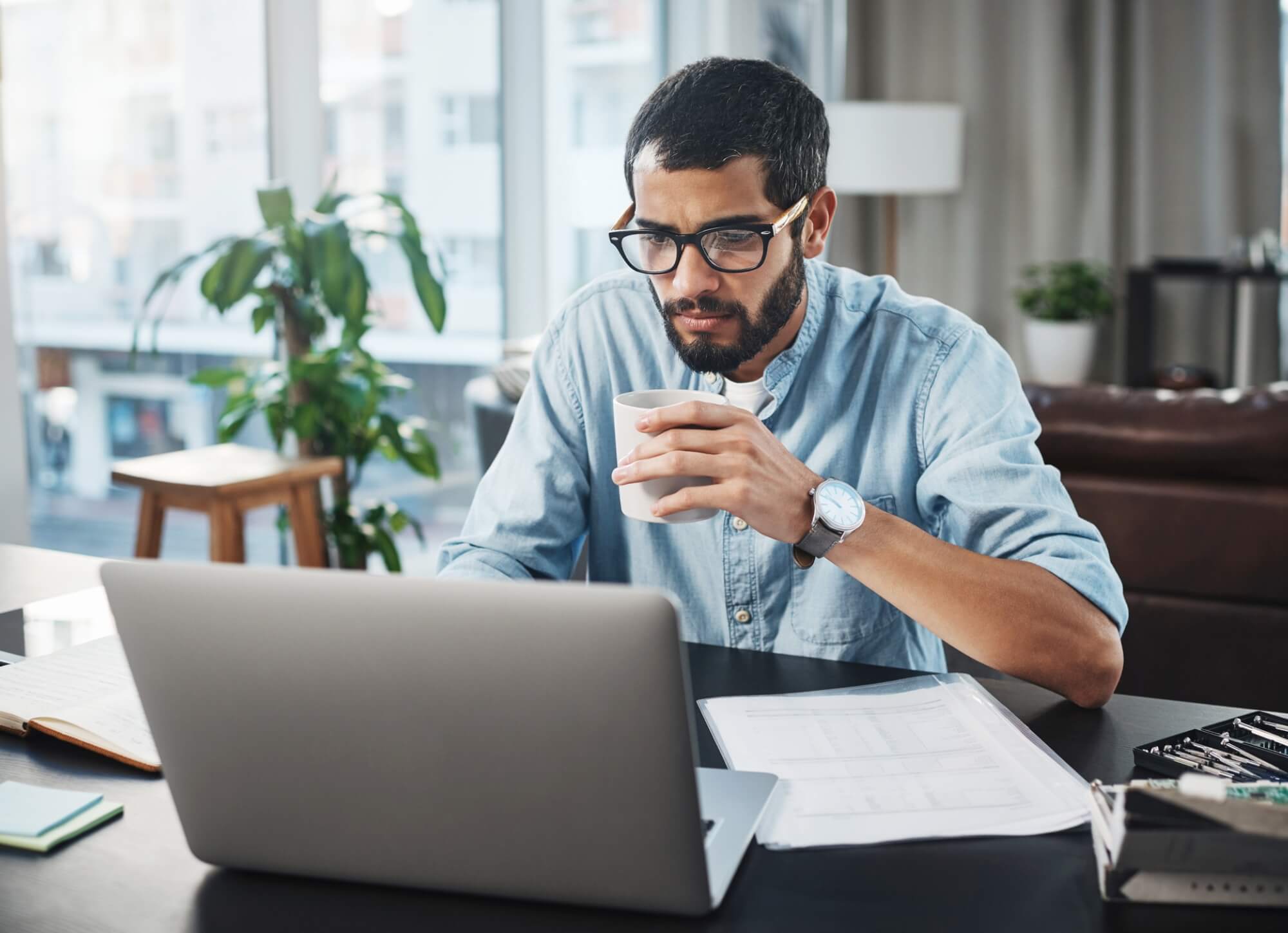 Professional male reading secure email in office