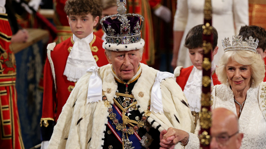 King Charles and Queen Consort Camilla make their way into Parliament in official dress 