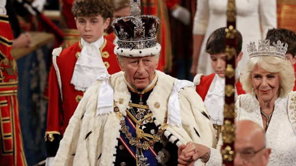 King Charles and Queen Consort Camilla make their way into Parliament in official dress 