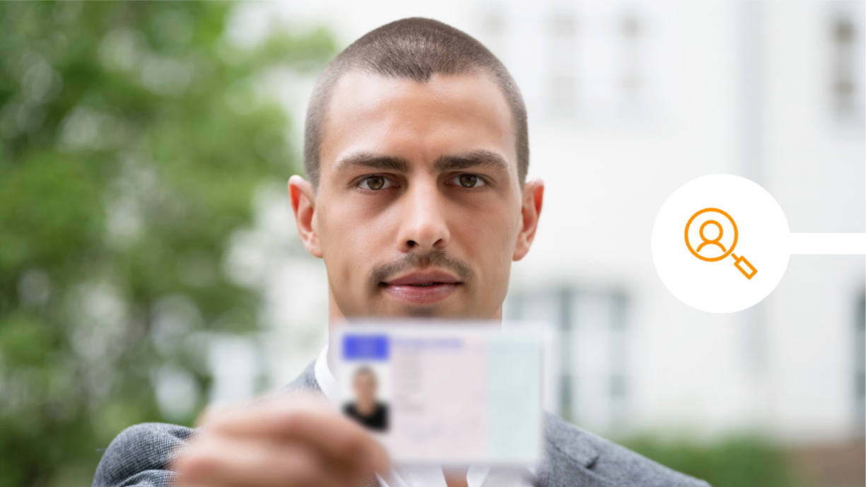 Male showing his UK driving licence