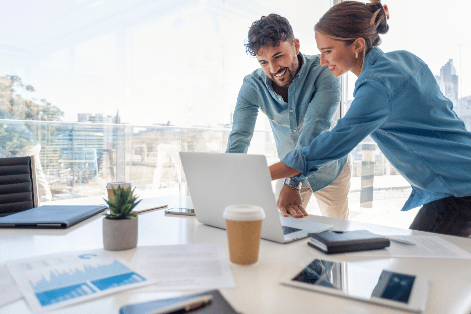 Man and woman in office assessing secure email solution