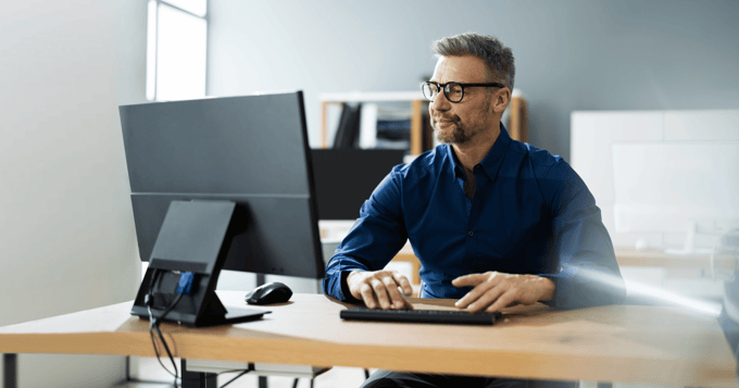 Man securing emails using desktop computer