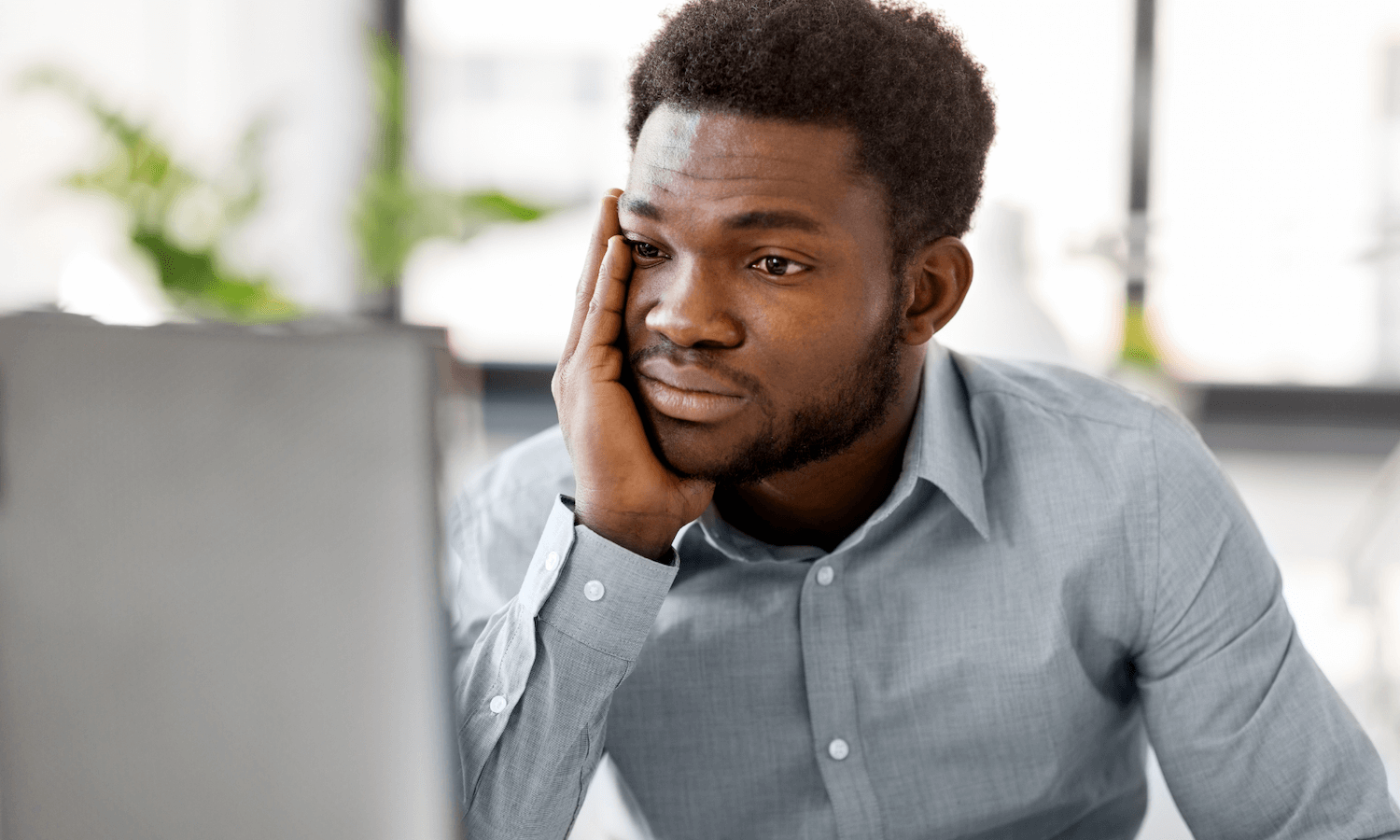 Man staring at computer screen