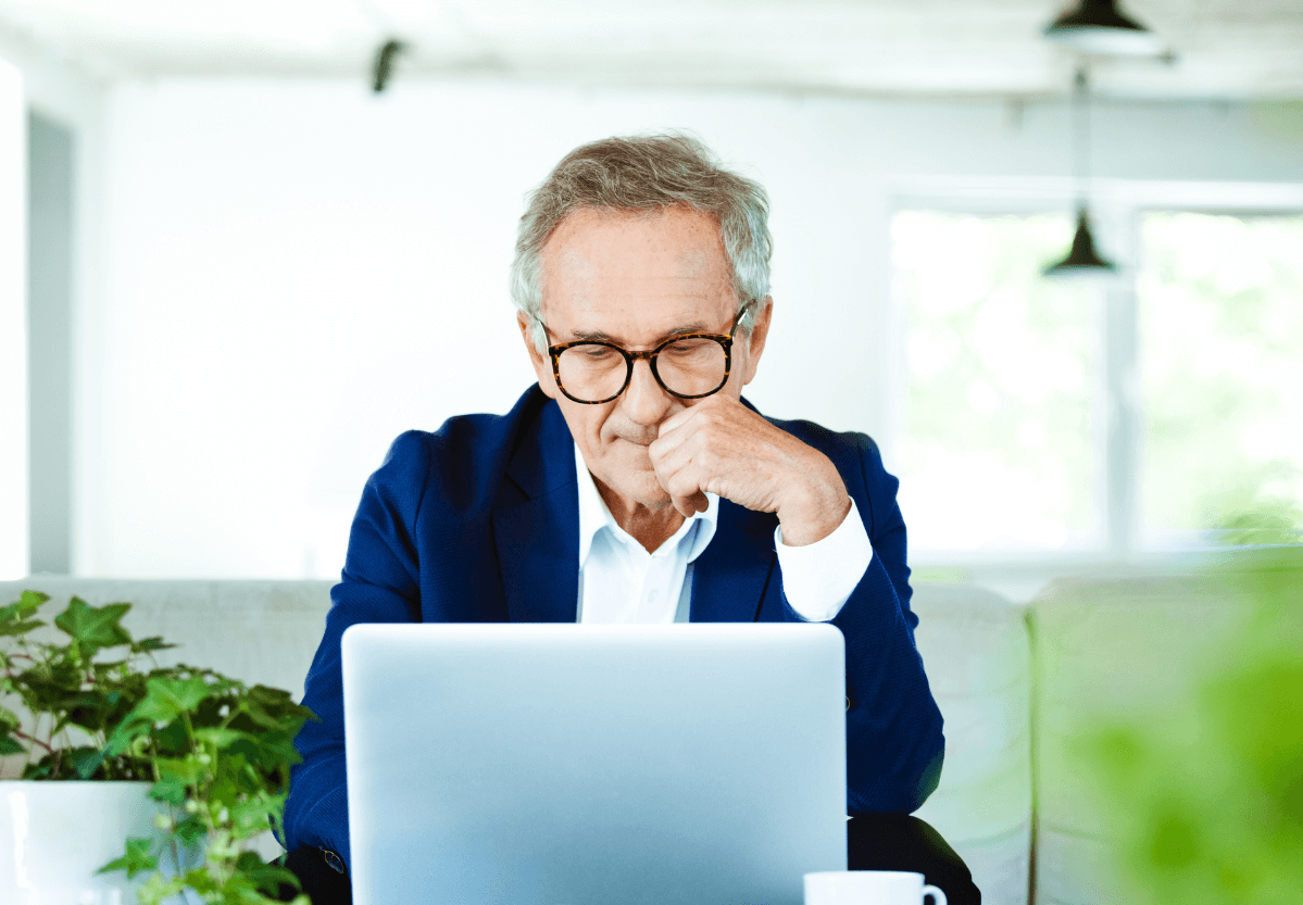 Man using free secure email on sofa in office