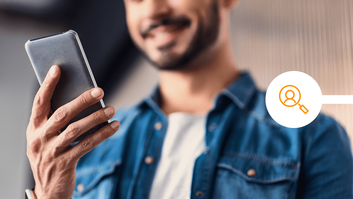 Man using smartphone to manage his finances