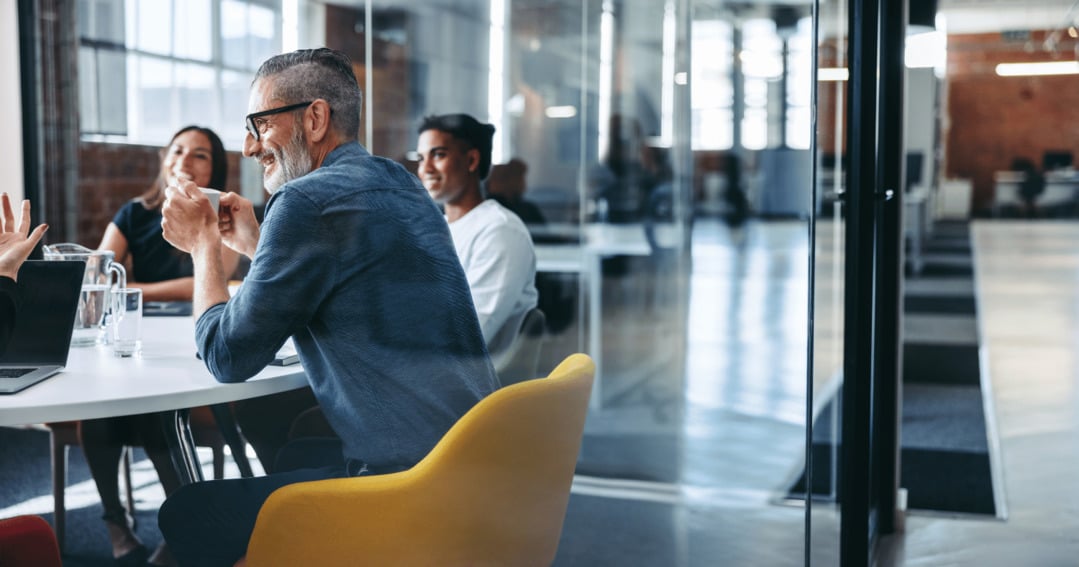 Team assessing cybersecurity software in office board room