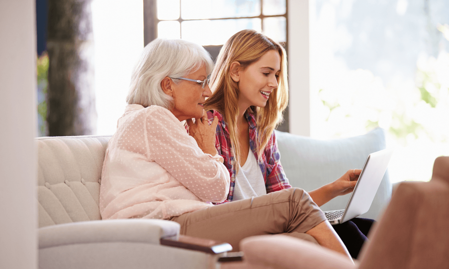 Mother and daughter securing emails on laptop