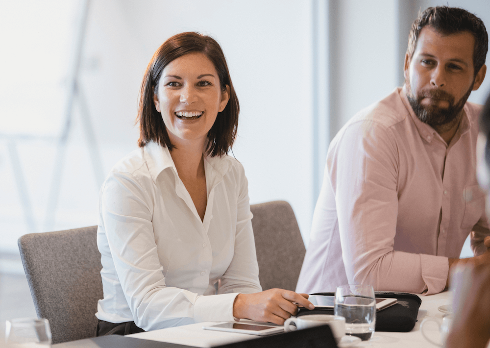 Professionals smiling in meeting