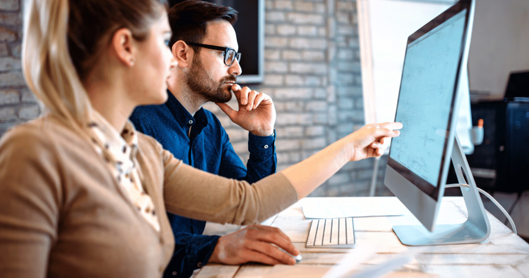 Staff in office using computer to protect their customer data