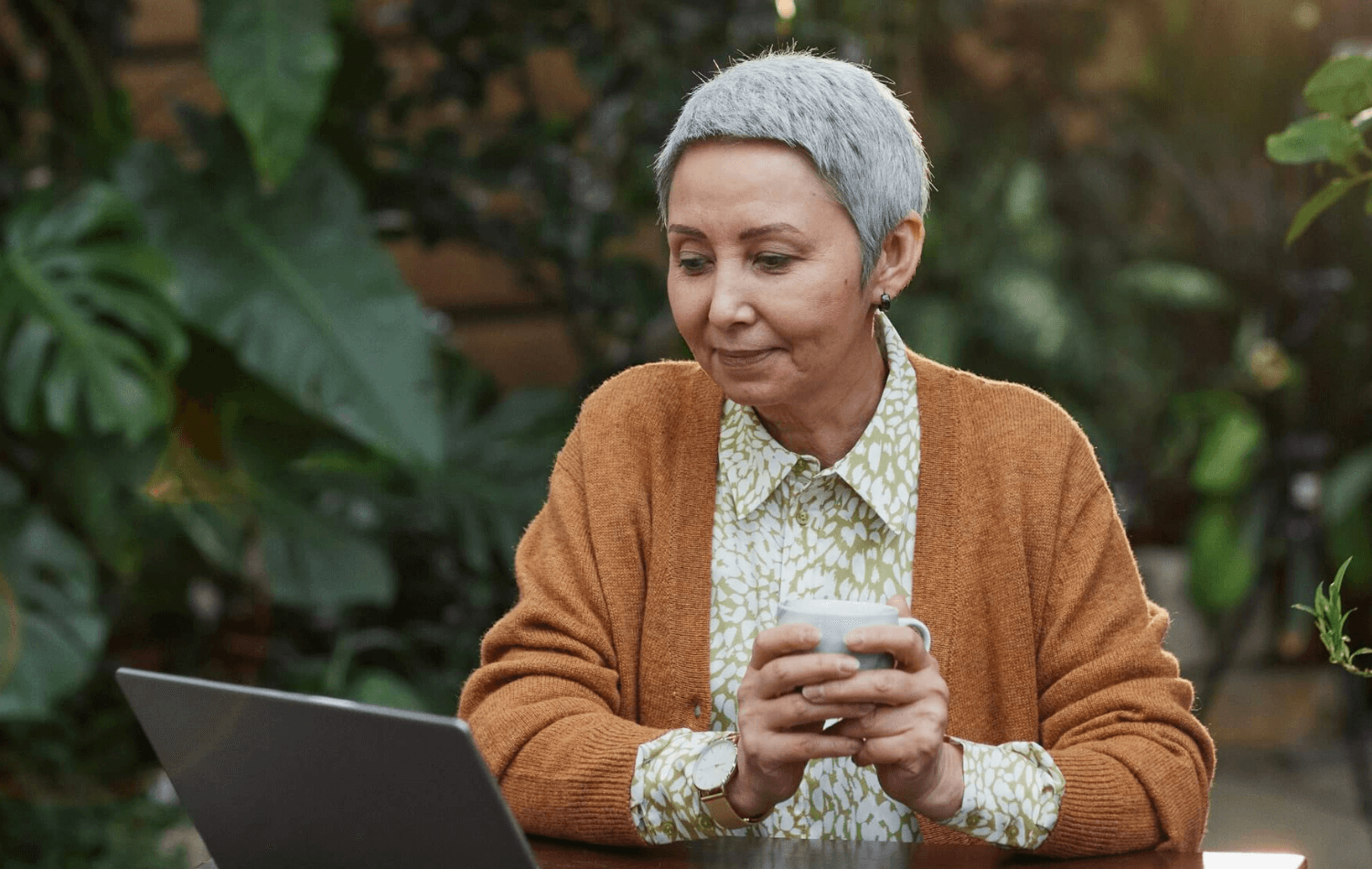 Sustainability officer drinking tea in garden