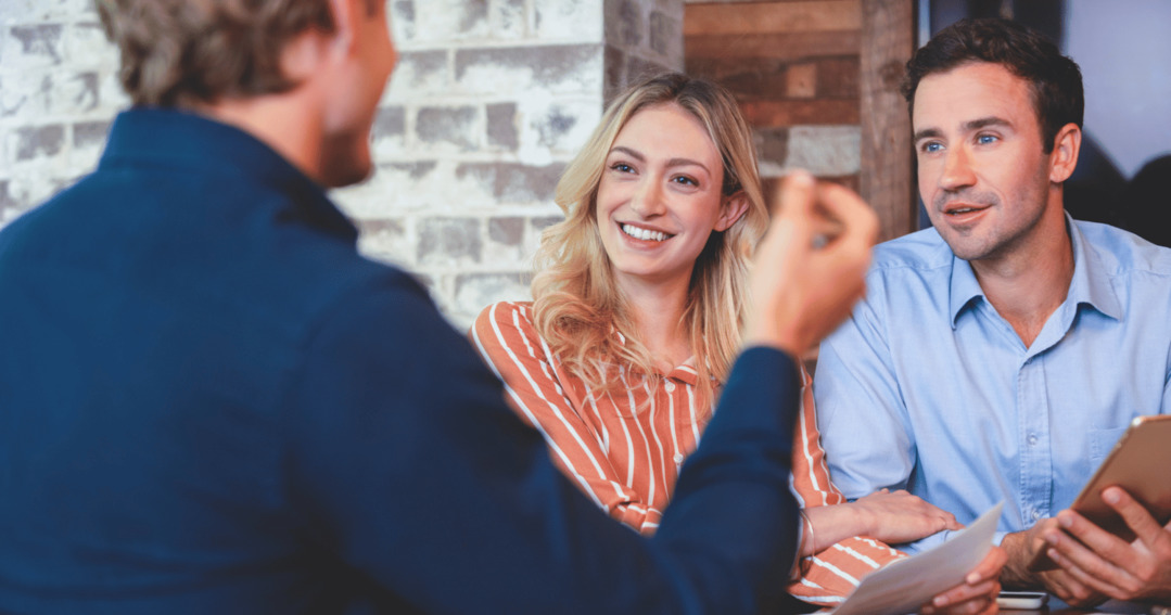 Financial adviser helping his clients with their mortgage