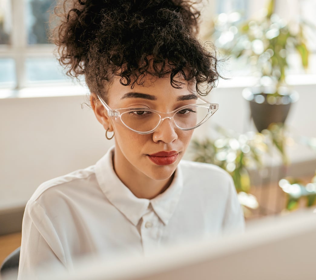 Female professional looking at computer screen with encrypted email