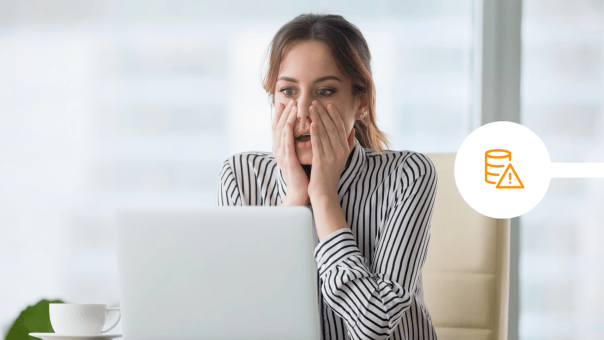 Woman shocked at laptop screen