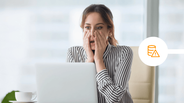 Woman shocked at laptop screen