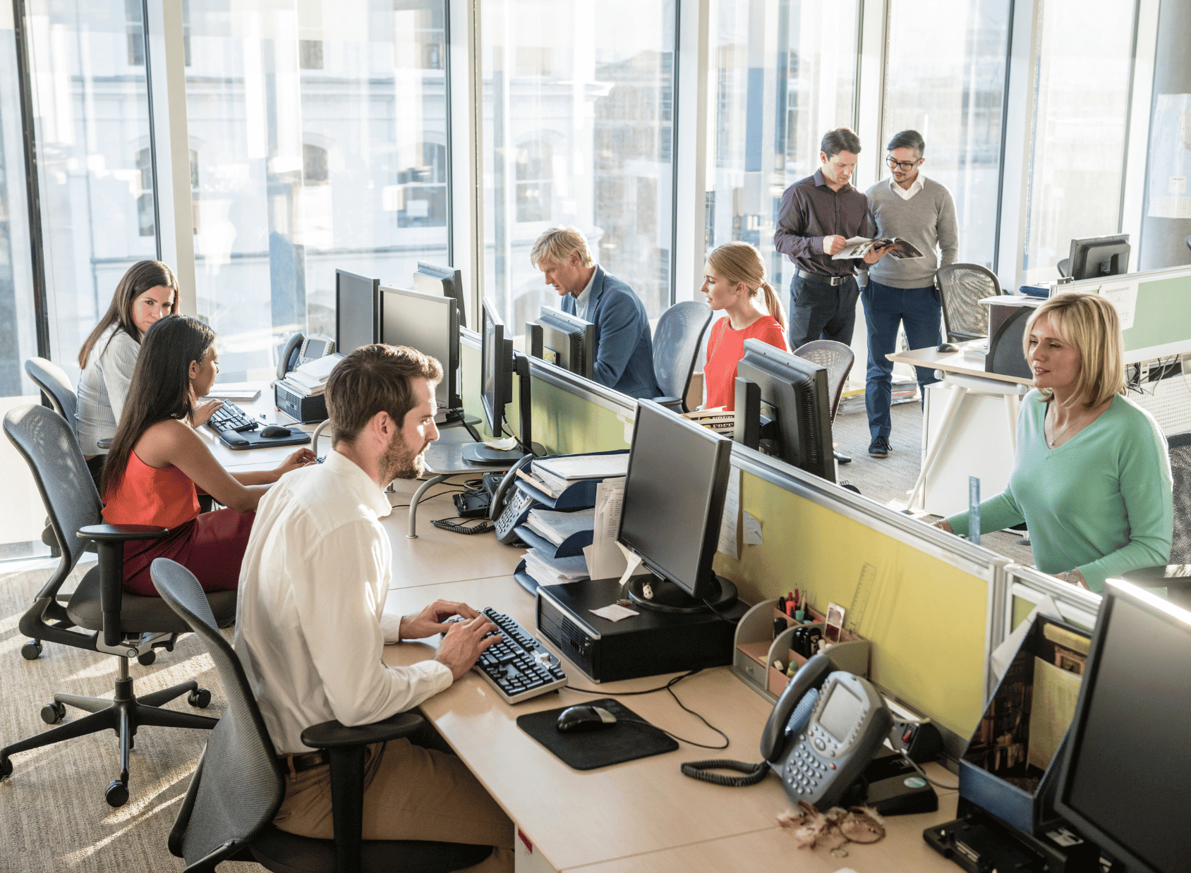 Contact centre operatives at work in office