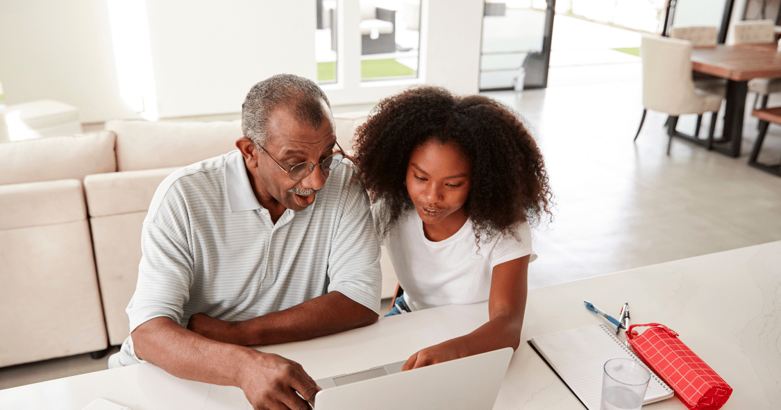 couple at home using laptop