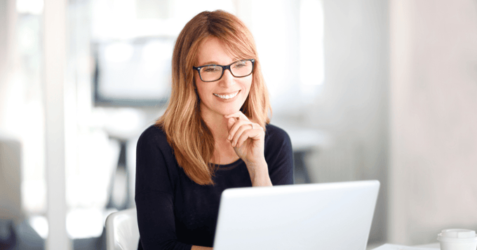 Female adviser securing emails at desk