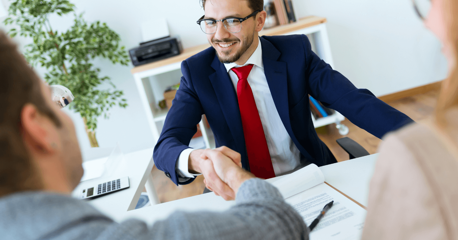 financial adviser shaking clients hand