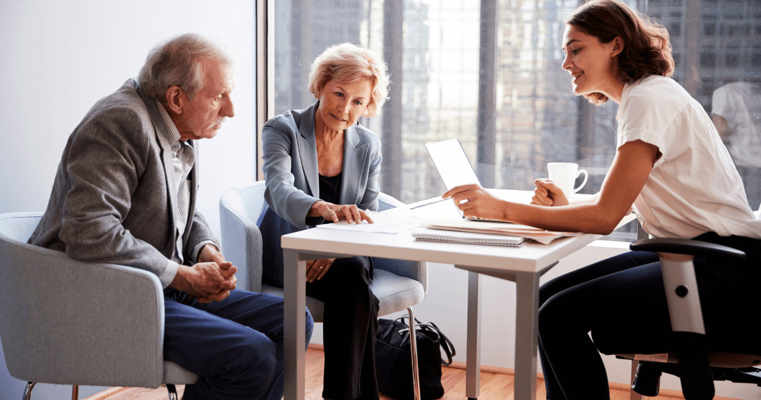 financial adviser speaking with her clients