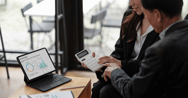 financial advisers reviewing the monthly budget