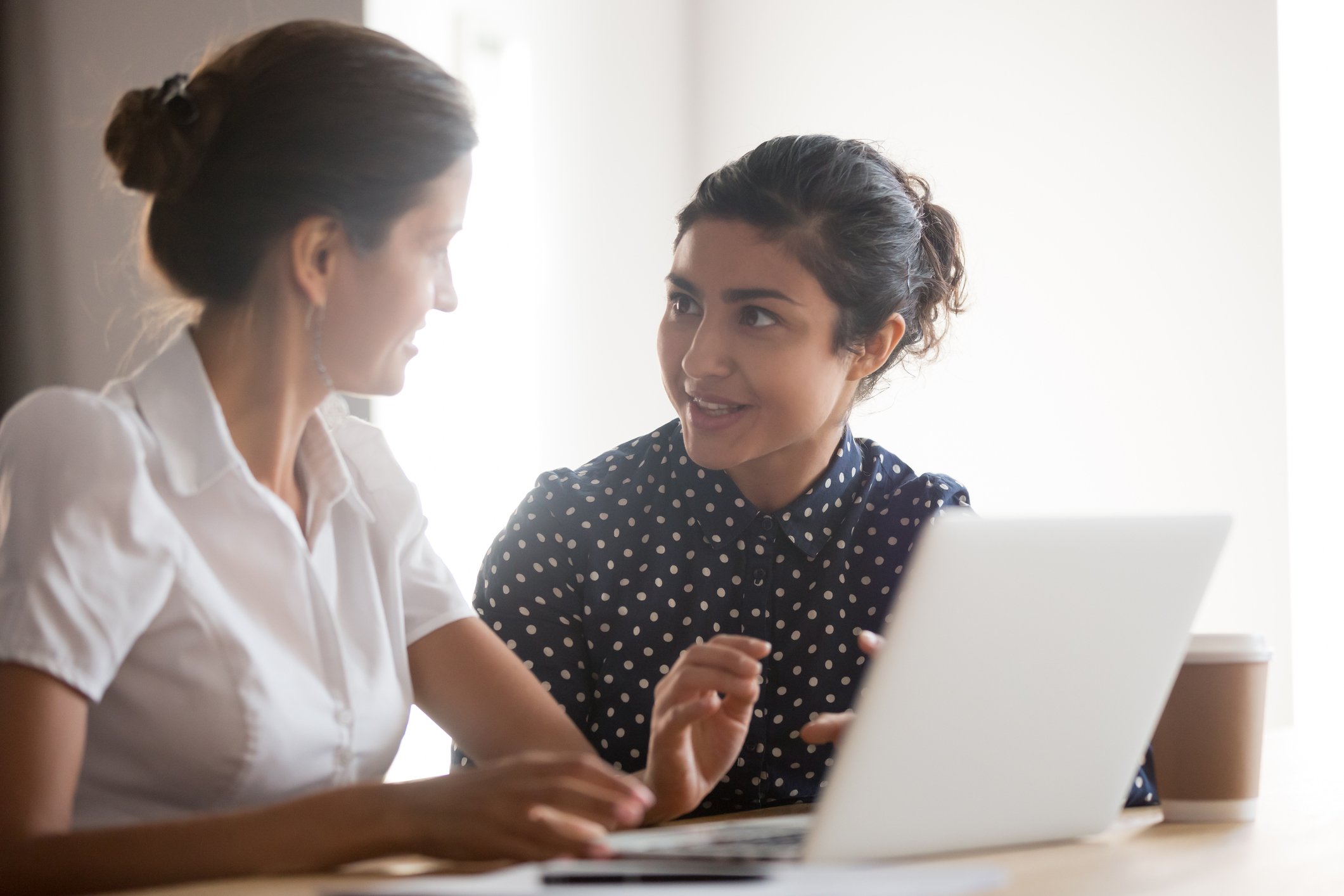 Woman helping staff member with secure email