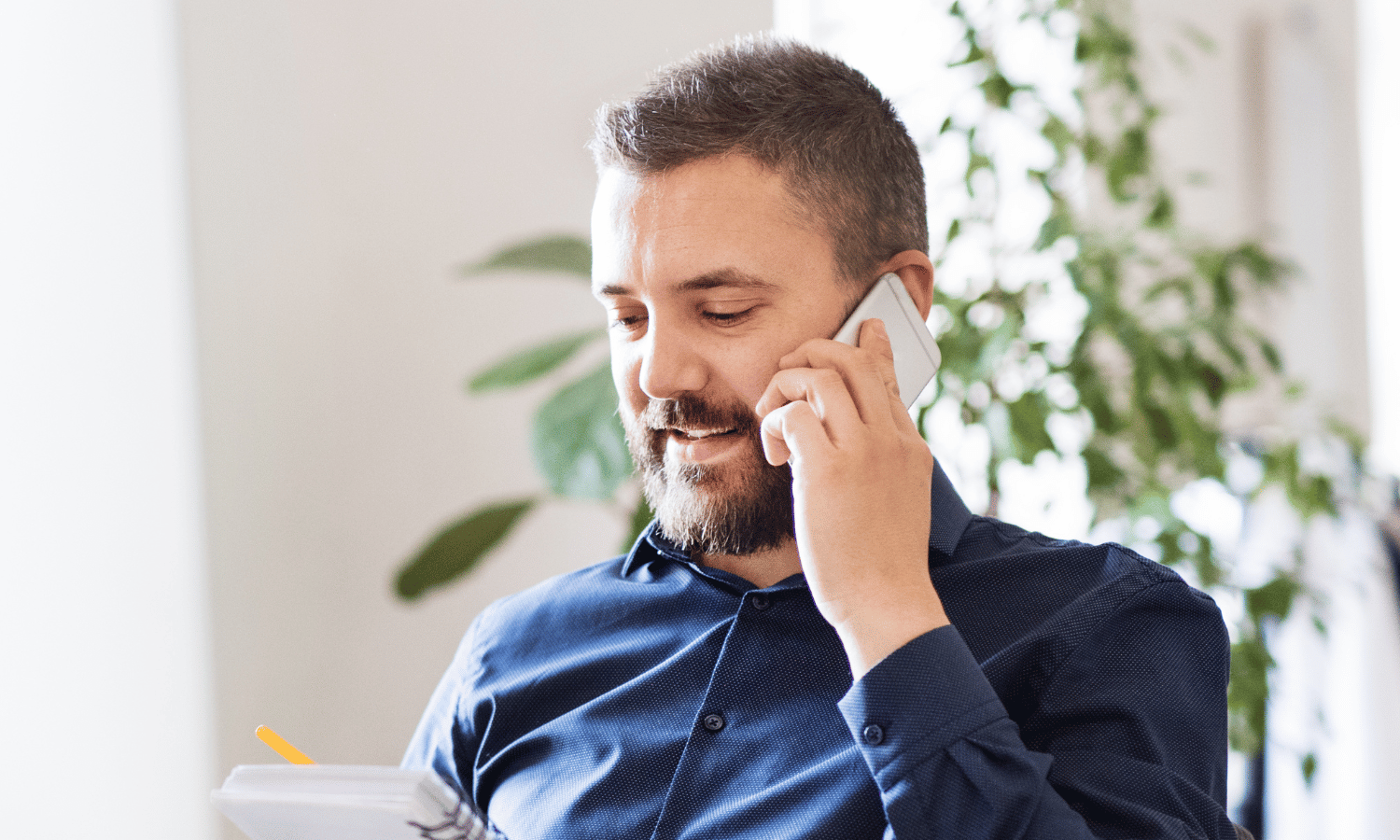 Financial services leader on the phone talking about secure email sustainability