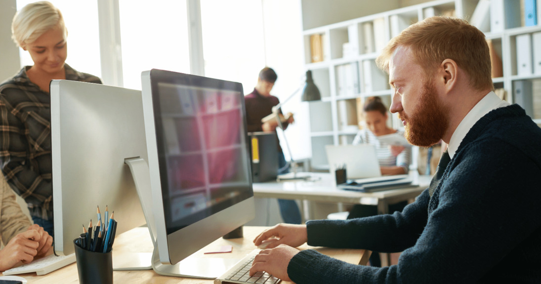 Man emailing securely at work