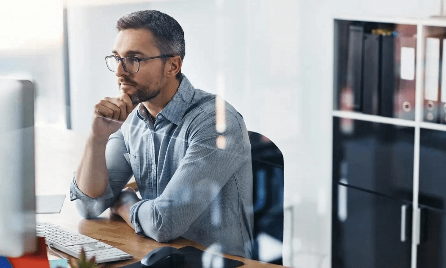 man in his home office using laptop for secure email