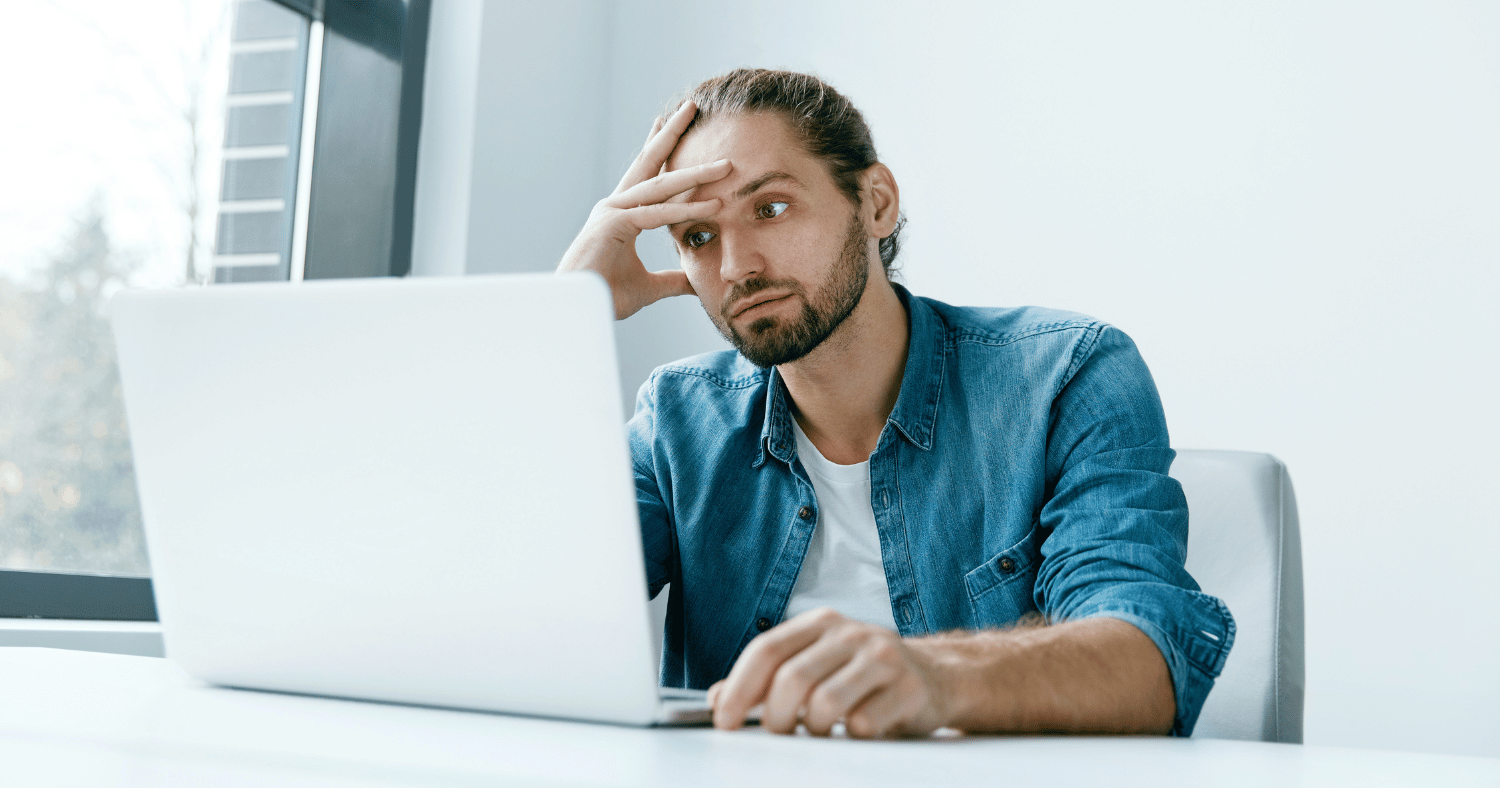 man in home office tired of working