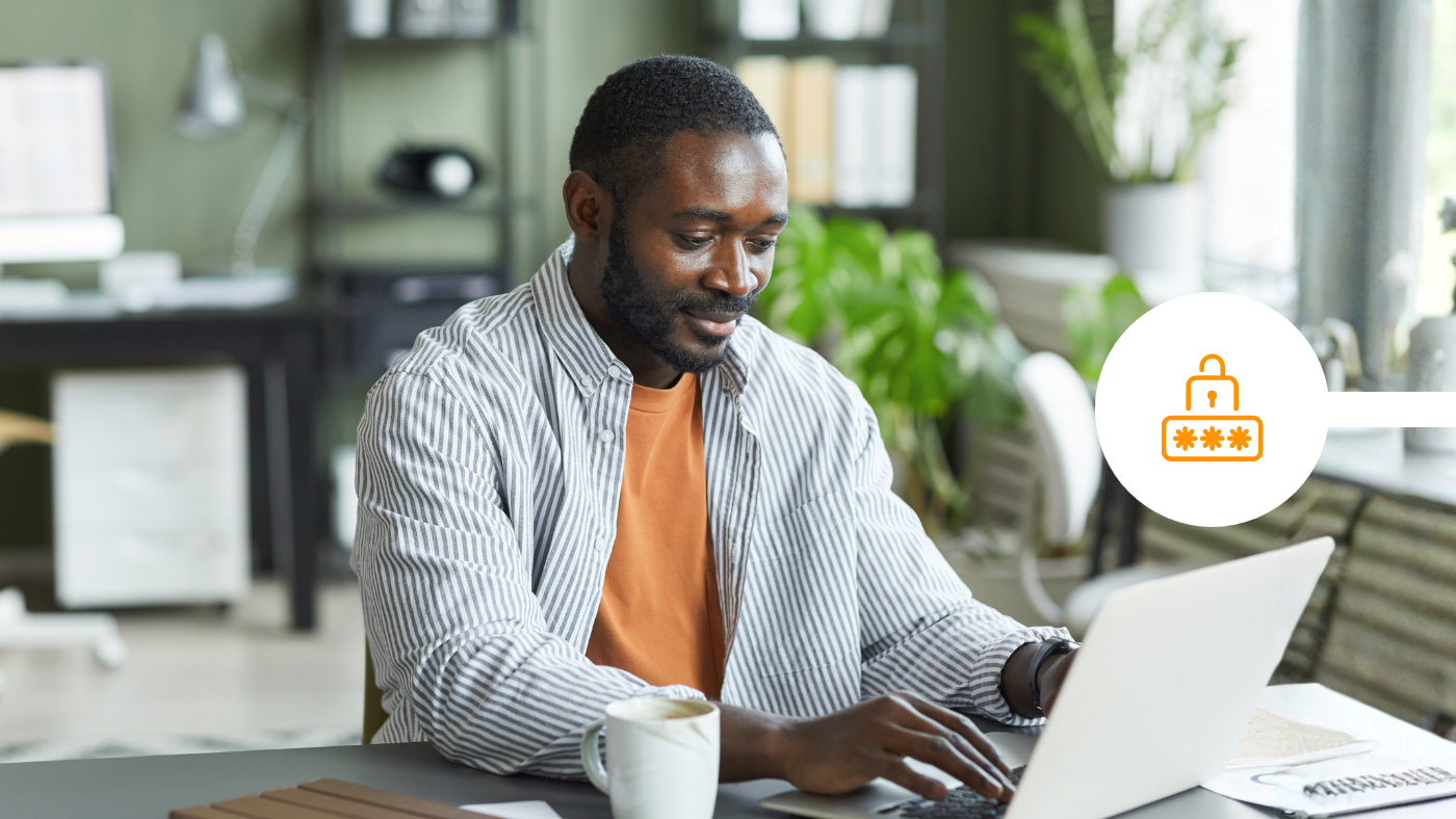 man sending secure email in office from laptop