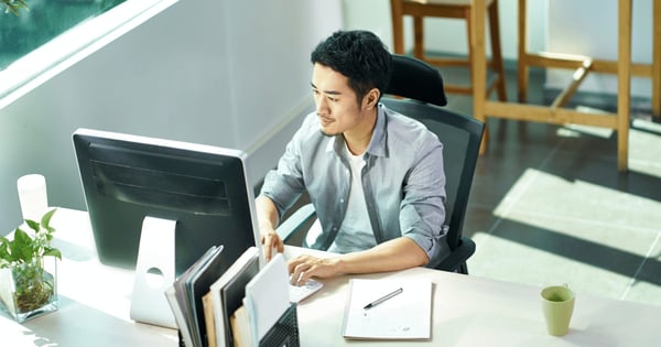 Man using email encryption gateway at work