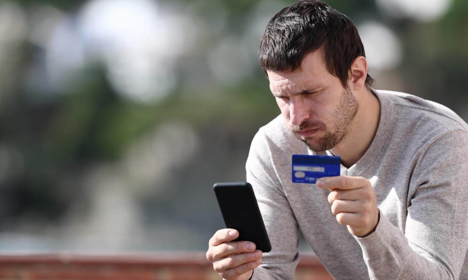man with credit card worried about risk of interception