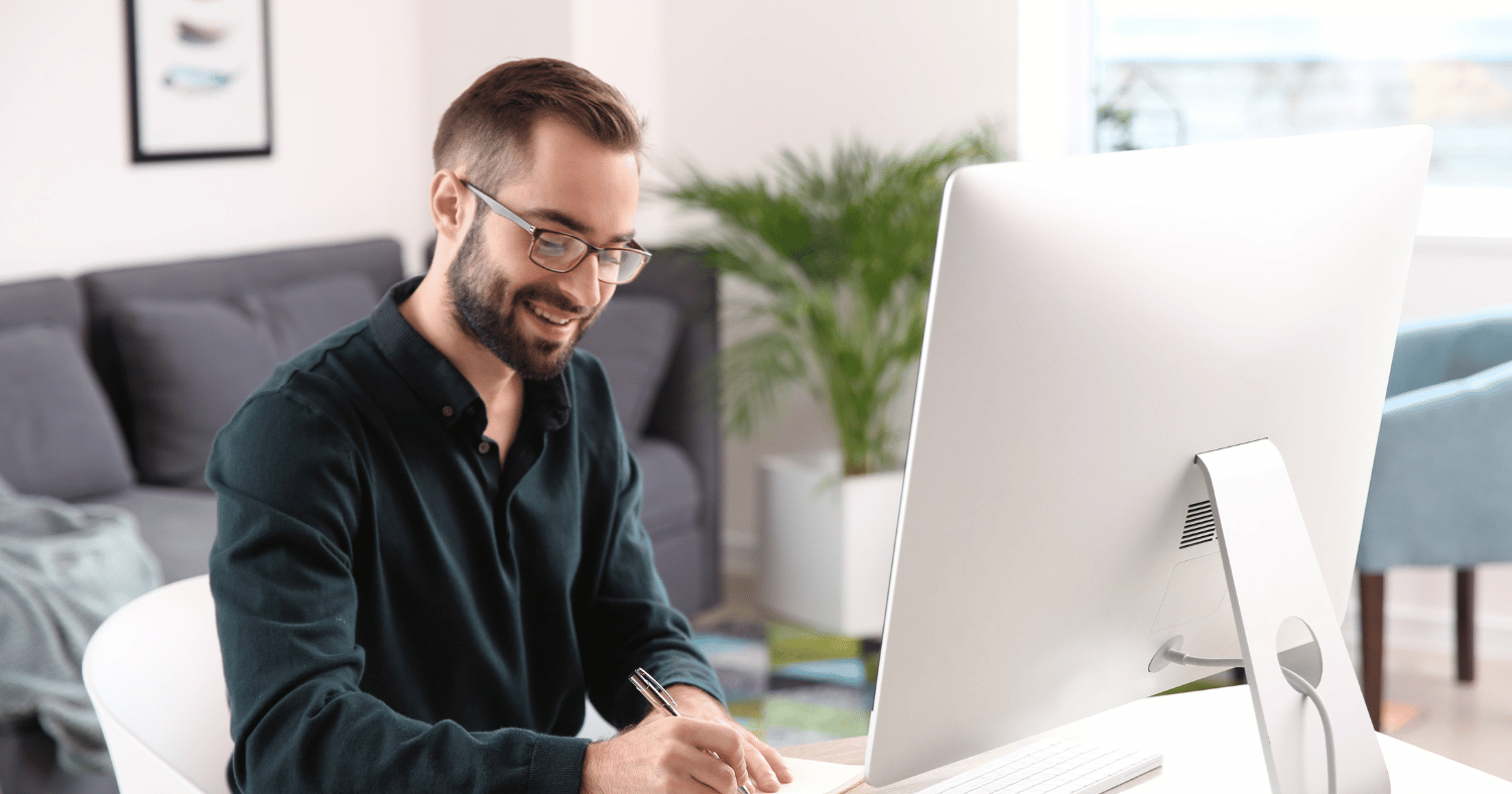 man working on his computer in office