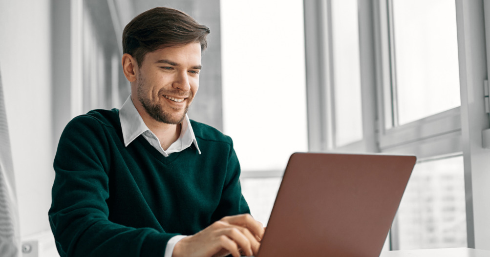 Professional man securing emails using laptop