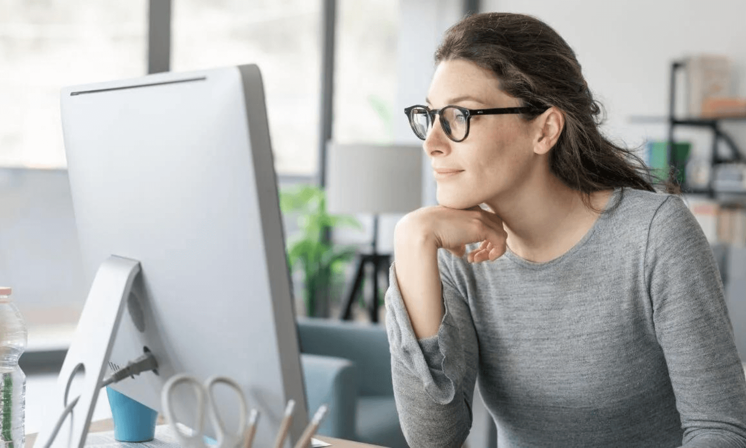 professional woman sending a secure email in office