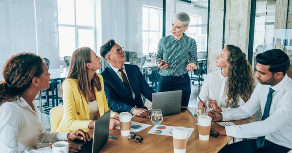 Team of professionals discussing secure email in board room