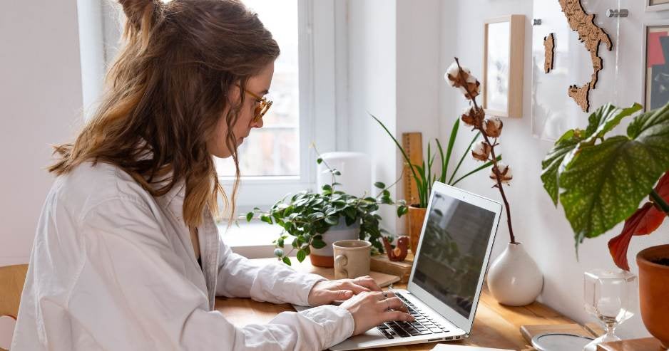 Woman sending email including personal data