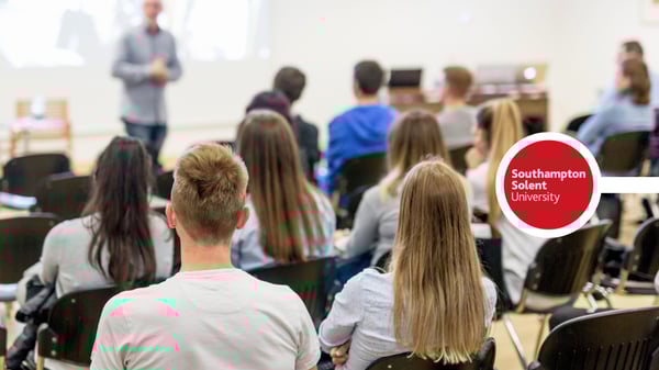 people listening to lecturer at uni